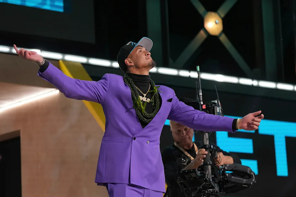 Arizona wide receiver Tetairoa McMillan celebrates after being chosen by the Carolina Panthers with the eighth overall pick during the first round of the NFL football draft, Thursday, April 24, 2025, in Green Bay, Wis. (AP Photo/Jeff Roberson)