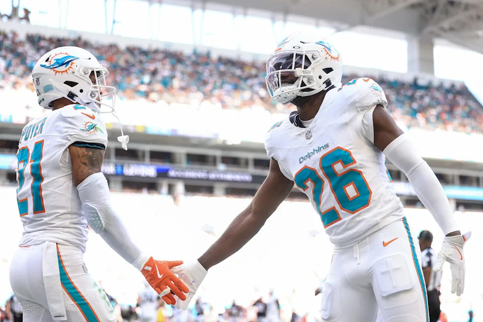 MIAMI GARDENS, FLORIDA - NOVEMBER 24: Marcus Maye #26 of the Miami Dolphins celebrates with Jordan Poyer #21 during the second half against the New England Patriots at Hard Rock Stadium on November 24, 2024 in Miami Gardens, Florida. (Photo by Carmen Mandato/Getty Images)