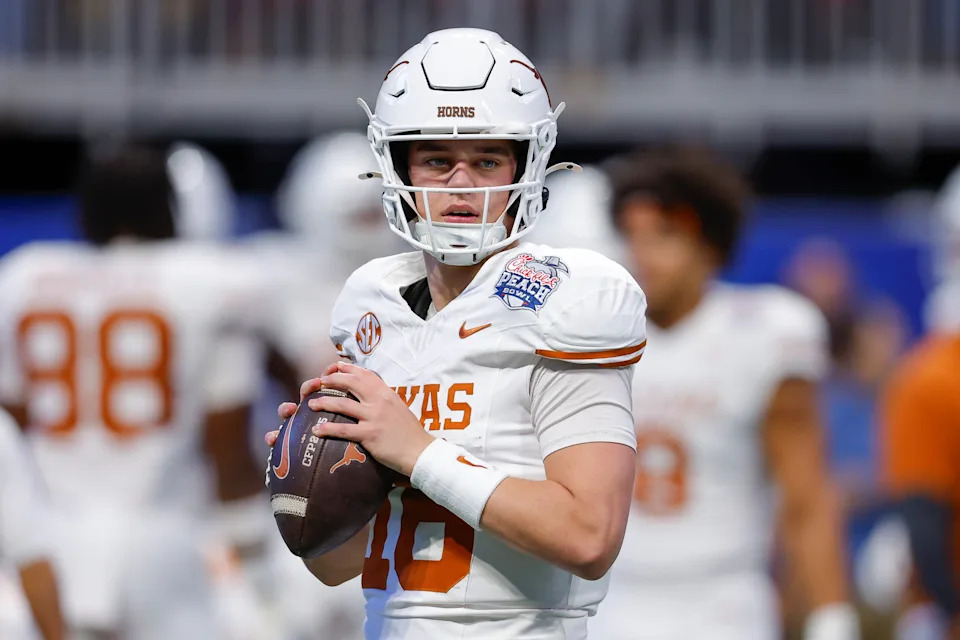 ATLANTA, GEORGIA - JANUARY 1: Arch Manning #16 of the Texas Longhorns warms up prior to the Chick-fil-A Peach Bowl between the Texas Longhorns and Arizona State Sun Devils at Mercedes-Benz Stadium on January 1, 2025 in Atlanta, Georgia. (Photo by Todd Kirkland/Getty Images)
