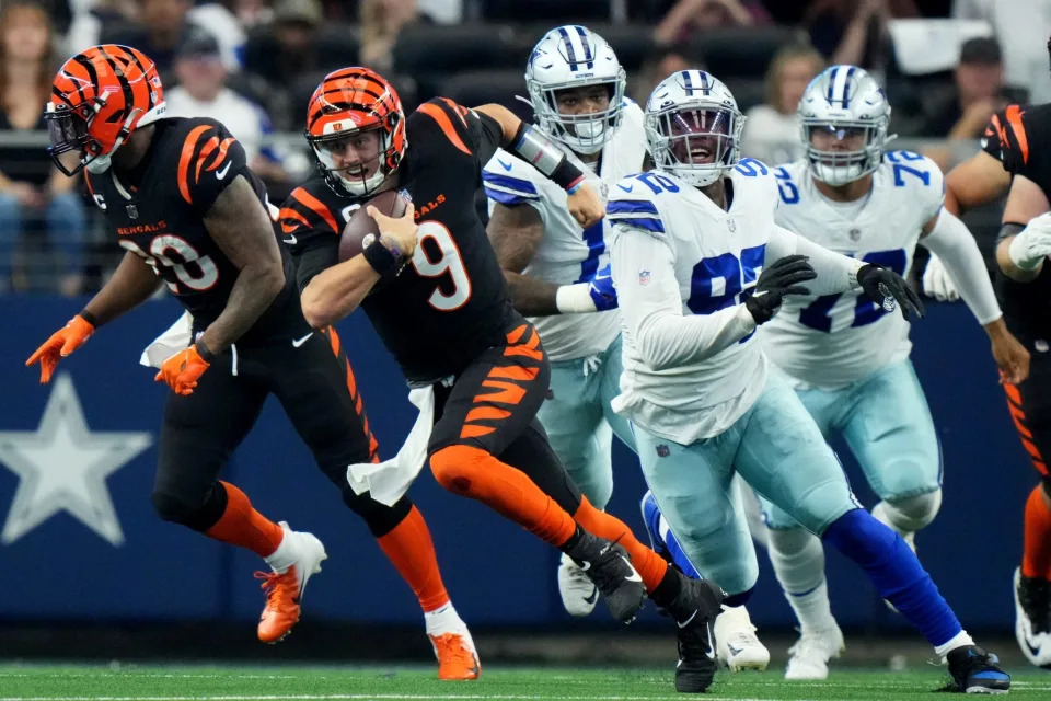 Cincinnati Bengals quarterback Joe Burrow (9) runs out of the pocket in the second quarter of an NFL Week 2 game against the Dallas Cowboys, Sunday, Sept. 18, 2022, at AT&T Stadium in Arlington, Texas.

Nfl Cincinnati Bengals At Dallas Cowboys Sept 18 2215