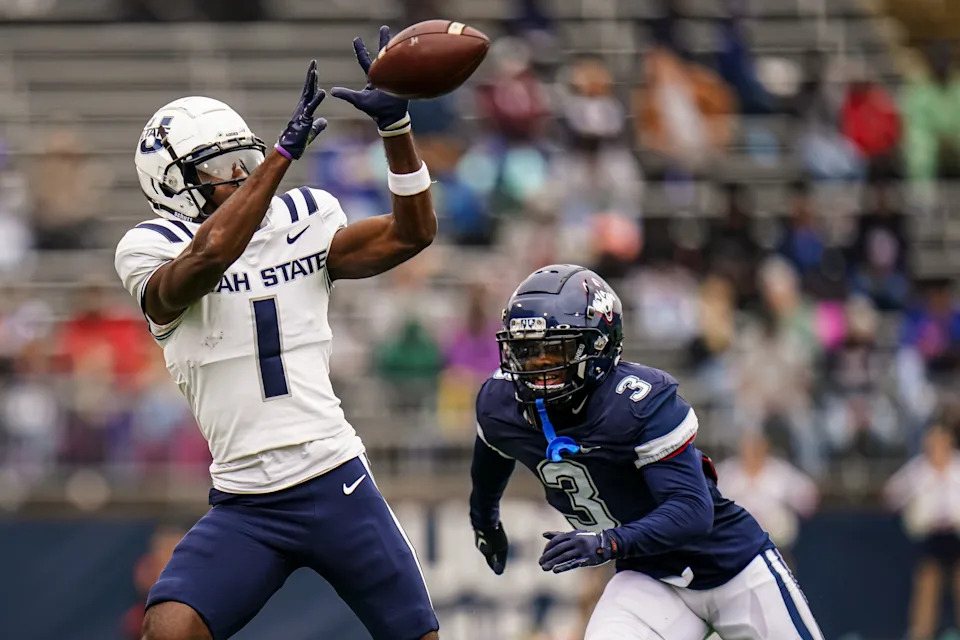 Sep 30, 2023; East Hartford, Connecticut, USA; Utah State Aggies wide receiver Jalen Royals (1) makes the catch against UConn Huskies defensive back D'Mon Brinson (3) in the second quarter at Rentschler Field at Pratt & Whitney Stadium. Mandatory Credit: David Butler II-USA TODAY Sports