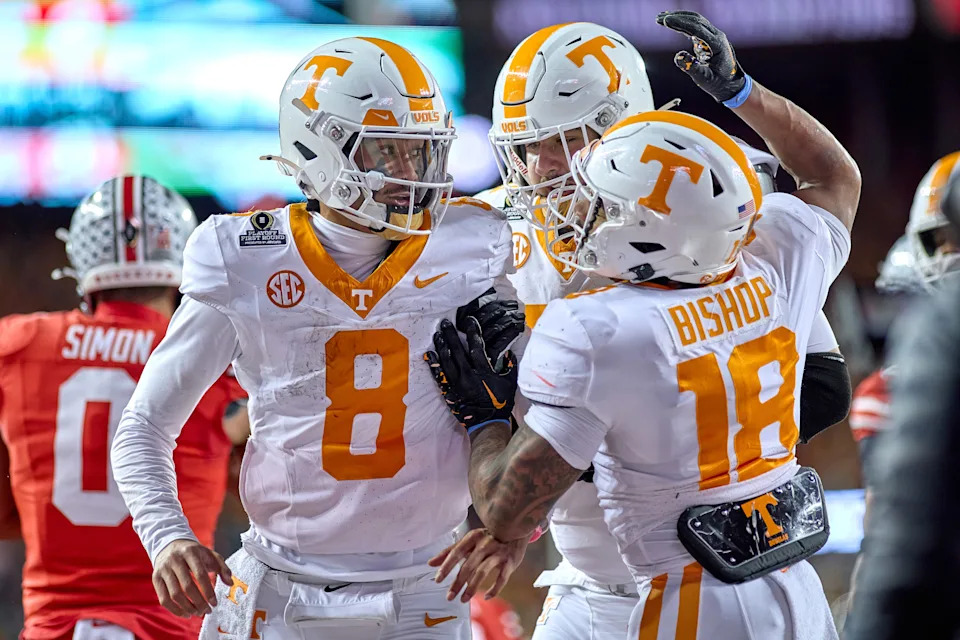 COLUMBUS, OHIO - DECEMBER 21: Quarterback Nico Iamaleava #8 of the Tennessee Volunteers celebrates with teammates after scoring a touchdown in action during the College Football Playoff First Round game between the Tennessee Volunteers and the Ohio State Buckeyes at Ohio Stadium on December 21, 2024 in Columbus, Ohio. (Photo by Robin Alam/ISI Photos/Getty Images)