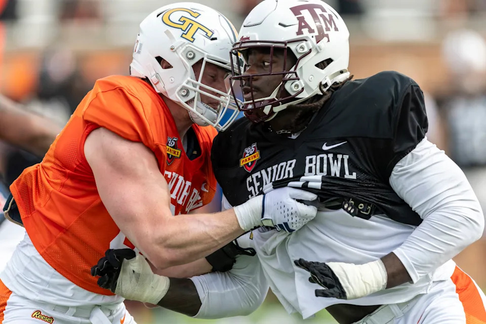 American team tight end Jackson Hawes of Georgia Tech spars with American team defensive lineman Shemar Stewart of Texas A&M.Vasha Hunt-Imagn Images