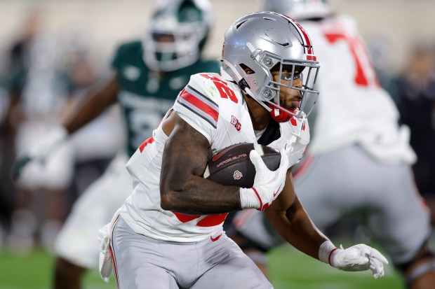 Ohio State running back TreVeyon Henderson runs during an NCAA college football game, Saturday, Sept. 28, 2024, in East Lansing, Mich. (AP Photo/Al Goldis)