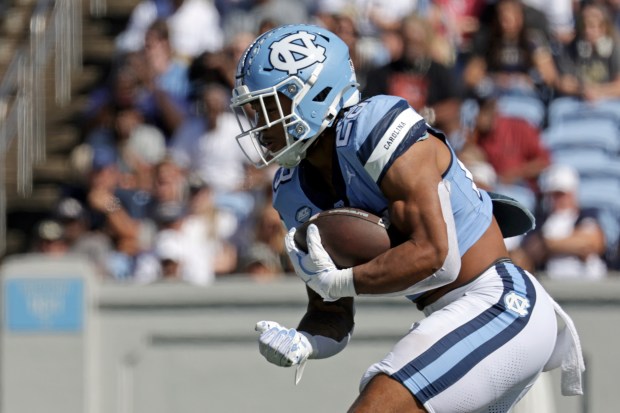 North Carolina running back Omarion Hampton (28) runs the ball during the first half an NCAA college football game against Georgia Tech, Saturday, Oct. 12, 2024, in Chapel Hill, N.C. (AP Photo/Chris Seward)