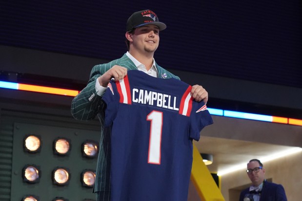 LSU offensive tackle Will Campbell poses after being chosen by the New England Patriots with the fourth overall pick during the first round of the NFL football draft, Thursday, April 24, 2025, in Green Bay, Wis. (AP Photo/Jeff Roberson)