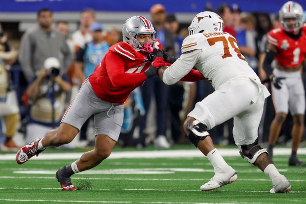 Texas offensive lineman Kelvin Banks Jr. blocks Ohio State defensive end JT Tuimoloau during the Cotton Bowl on Jan. 10, 2025, in Arlington, Texas. (AP Photo/Gareth Patterson)
