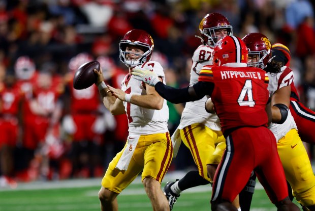 Southern California quarterback Miller Moss is pressured by Maryland linebacker Ruben Hyppolite II during the second half on Oct. 19, 2024, in College Park, Md. (AP Photo/Alyssa Howell)