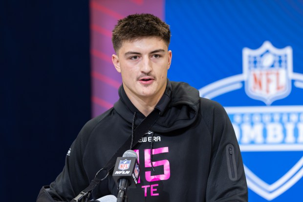 Colston Loveland speaks to the media during the NFL combine...