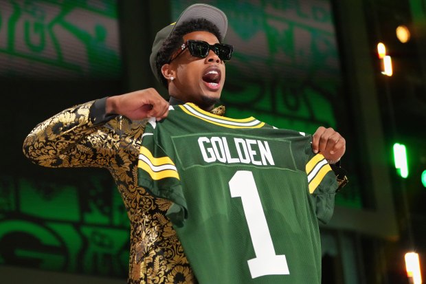 Texas wide receiver Matthew Golden celebrates after being chosen by the Packers with the 23rd pick during the first round of the NFL draft April 24, 2025, in Green Bay. (AP Photo/Jeff Roberson)
