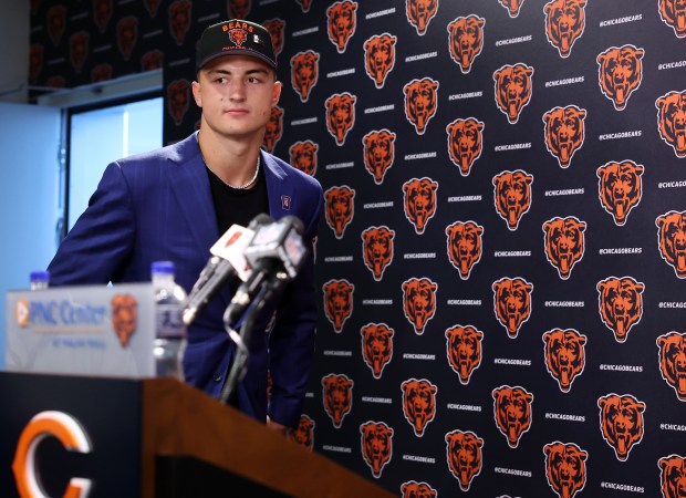 Bears tight end Colston Loveland steps up to the microphone...