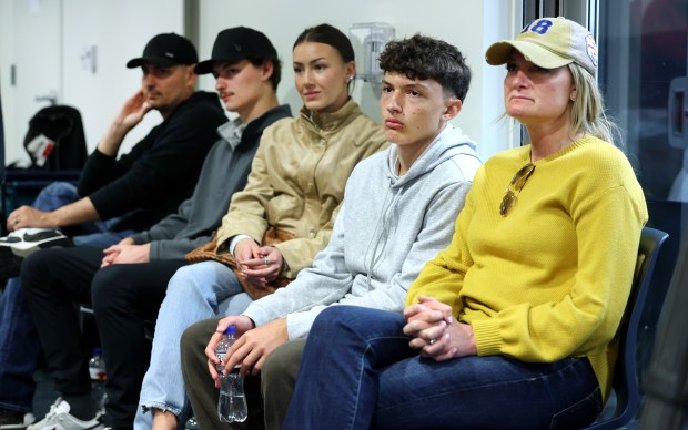 The family of tight end Colston Loveland listens in as...