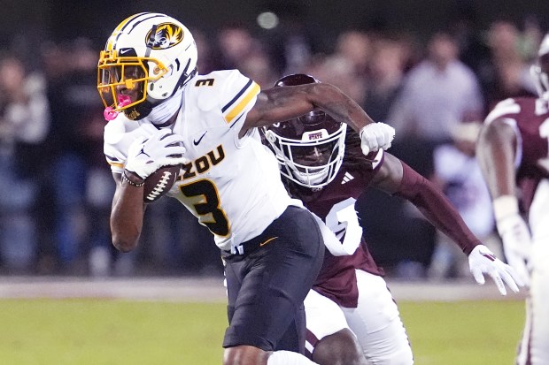 Missouri wide receiver Luther Burden III (3) sprints past a Mississippi State defender with a first-down reception on Nov. 23, 2024, in Starkville, Miss. (Rogelio V. Solis/AP)