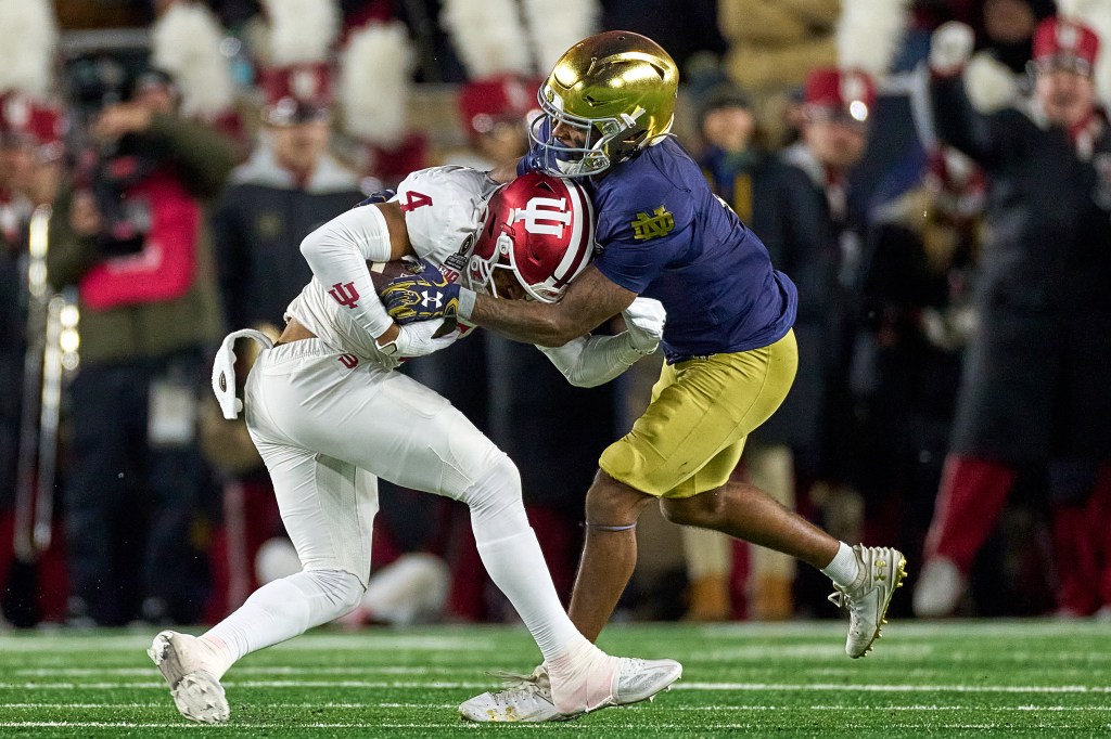 Indiana Hoosiers wide receiver Myles Price #4 battles with Notre Dame Fighting Irish safety Jordan Clark #1 in action during the Playoff First Round game between the Notre Dame Fighting Irish and the Indiana Hoosiers.