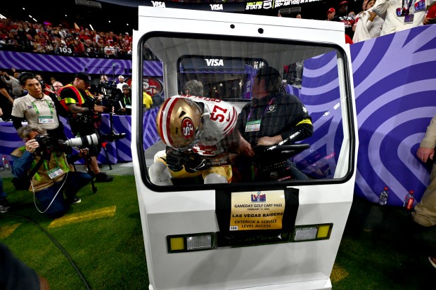 San Francisco 49ers' Dre Greenlaw (57) exits the field after suffering a torn tendon on his left leg in the second quarter of the Super Bowl against the Kansas City Chiefs in Las Vegas, Nev., on Sunday, Feb. 11, 2024. (Jose Carlos Fajardo/Bay Area News Group)