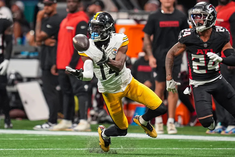 Sep 8, 2024; Atlanta, Georgia, USA; Pittsburgh Steelers wide receiver George Pickens (14) makes a catch in front of Atlanta Falcons cornerback A.J. Terrell (24) at Mercedes-Benz Stadium. Mandatory Credit: Dale Zanine-Imagn Images