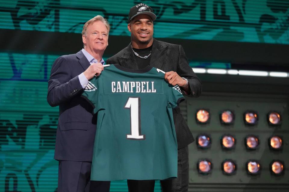 Jihaad Campbell holding his Philadelphia Eagles jersey.