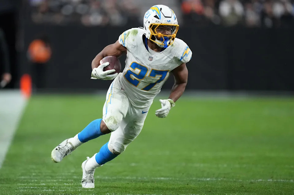 Jan 5, 2025; Paradise, Nevada, USA; Los Angeles Chargers running back J.K. Dobbins (27) carries the ball against the Las Vegas Raiders in the second half at Allegiant Stadium. Mandatory Credit: Kirby Lee-Imagn Images