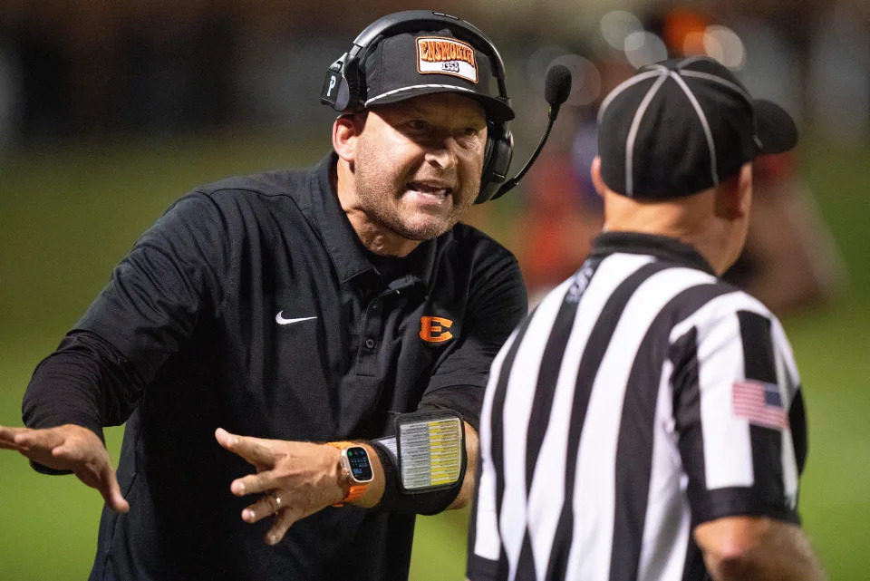 Ensworth Head Coach Tim Hasselbeck illustrates how a Lipscomb Academy player pushed his receiver out of bounds on a deep pass during their game at Ensworth High School in Nashville, Tenn., Friday, Sept. 20, 2024.