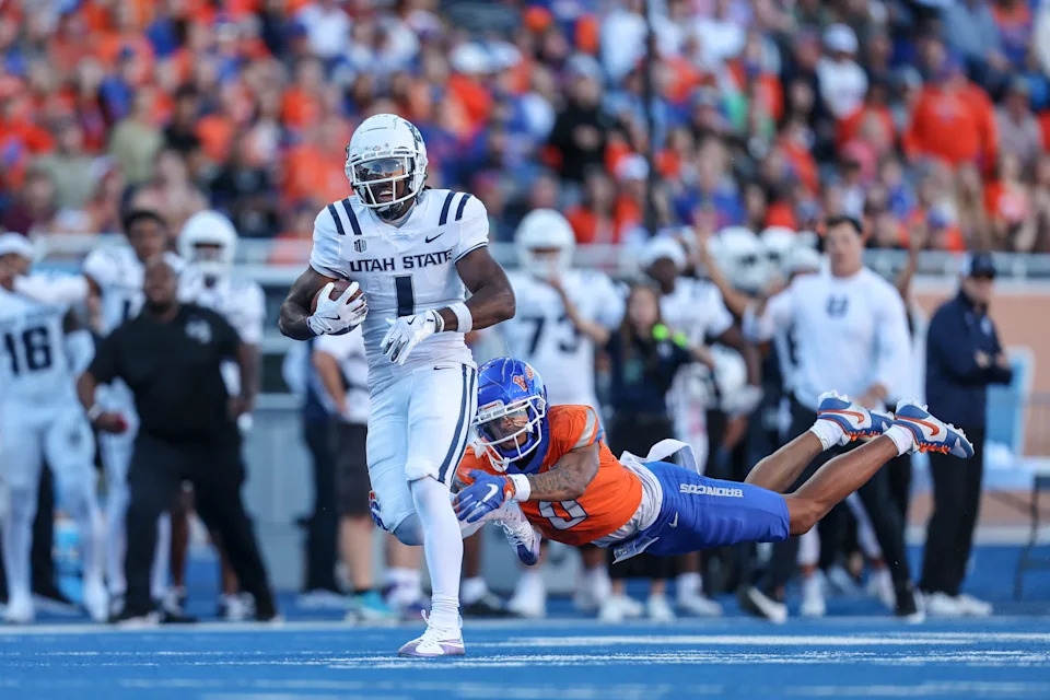 BOISE, ID - OCTOBER 5: Wide receiver Jalen Royals #1 of the Utah State Aggies catches a long touchdown pass during the first half against the Utah State Aggies at Albertsons Stadium on October 5, 2024 in Boise, Idaho. (Photo by Loren Orr/Getty Images)