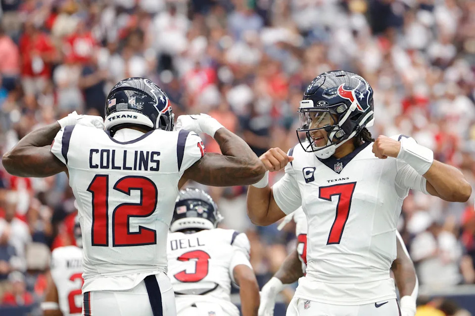 HOUSTON, TEXAS - SEPTEMBER 17: Nico Collins #12 of the Houston Texans celebrates with C.J. Stroud #7 after scoring a receiving touchdown during the first quarter against the Indianapolis Colts at NRG Stadium on September 17, 2023 in Houston, Texas. (Photo by Carmen Mandato/Getty Images)