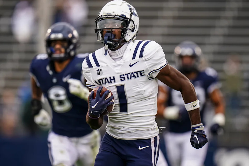 Sep 30, 2023; East Hartford, Connecticut, USA; Utah State Aggies wide receiver Jalen Royals (1) runs the ball for a touchdown against the UConn Huskies in the second half at Rentschler Field at Pratt & Whitney Stadium. Mandatory Credit: David Butler II-USA TODAY Sports
