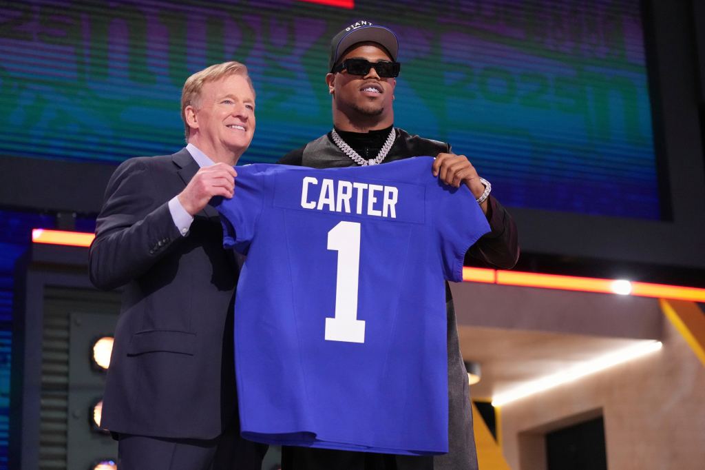 Penn State defensive end Abdul Carter, right, poses with NFL Commissioner Roger Goodell after being chosen by the New York Giants with the third overall pick during the first round of the NFL football draft, Thursday, April 24, 2025,