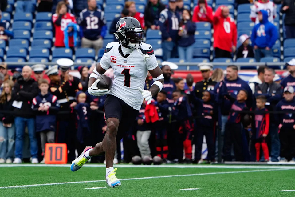 Oct 13, 2024; Foxborough, Massachusetts, USA; Houston Texans wide receiver Stefon Diggs (1) warms up prior to the game against the New England Patriots at Gillette Stadium. Mandatory Credit: Gregory Fisher-Imagn Images