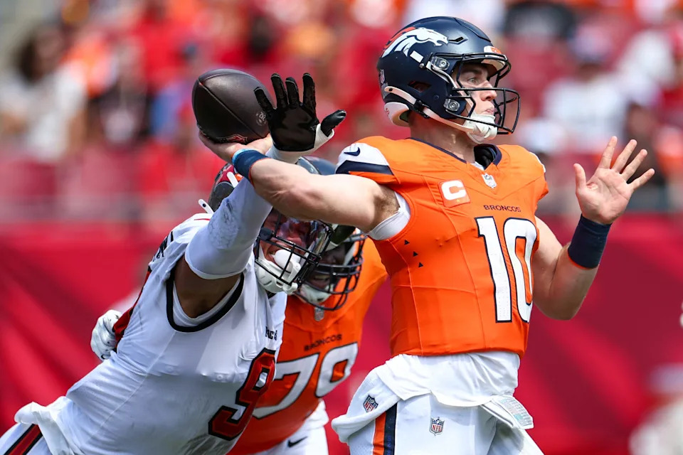 Sep 22, 2024; Tampa, Florida, USA; Tampa Bay Buccaneers linebacker Joe Tryon-Shoyinka (9) pressures Denver Broncos quarterback Bo Nix (10) in the third quarter at Raymond James Stadium. Mandatory Credit: Nathan Ray Seebeck-Imagn Images