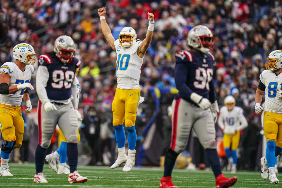 Dec 28, 2024; Foxborough, Massachusetts, USA; Los Angeles Chargers quarterback Justin Herbert (10) reacts after his touchdown pass against the New England Patriots in the third quarter at Gillette Stadium. Mandatory Credit: David Butler II-Imagn Images