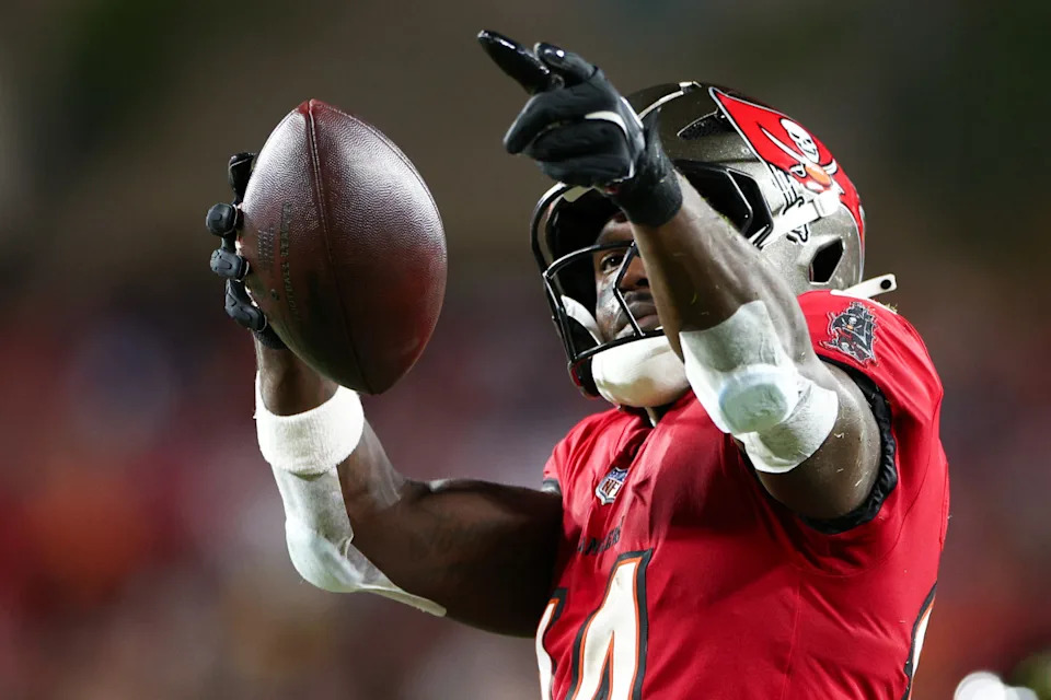 Oct 21, 2024; Tampa, Florida, USA; Tampa Bay Buccaneers wide receiver Chris Godwin (14) celebrates a first down against the Baltimore Ravens in the second quarter at Raymond James Stadium.Nathan Ray Seebeck-Imagn Images
