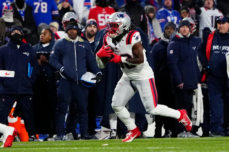 Dec 22, 2024; Orchard Park, New York, USA; New England Patriots running back Rhamondre Stevenson (38) runs with the ball after making a catch against the Buffalo Bills during the first half at Highmark Stadium. Mandatory Credit: Gregory Fisher-Imagn Images