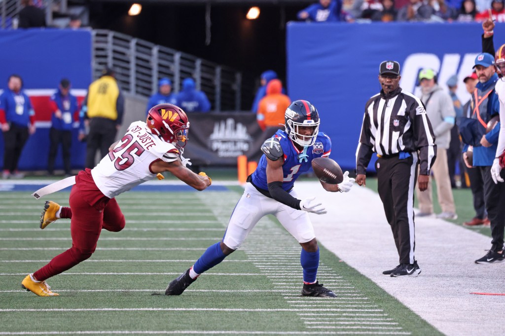 Giants receiver Malik Nabers (1) makes a catch against the Commanders last season.