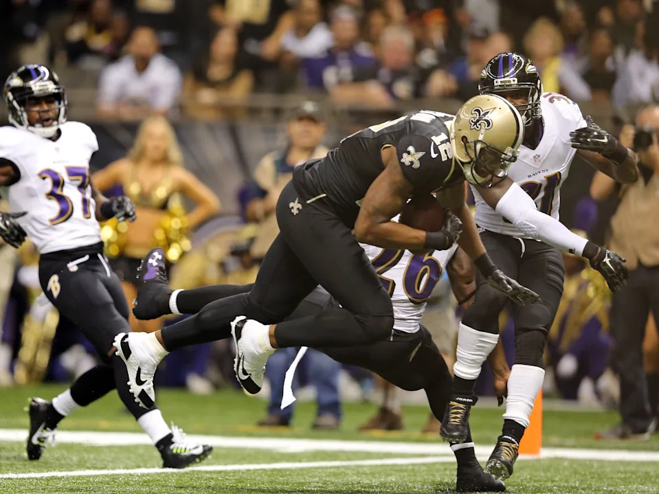 Nov 24, 2014; New Orleans, LA, USA; New Orleans Saints wide receiver Marques Colston (12) scores on a 26-yard catch against the Baltimore Ravens in the second quarter of their game at the Mercedes-Benz Superdome. Mandatory Credit: Chuck Cook-USA TODAY Sports