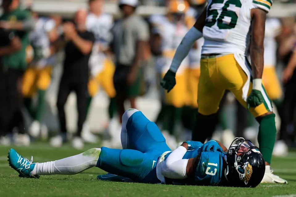Jaguars wide receiver Christian Kirk (13) lies on the turf after an apparent injury during an NFL football matchup© Corey Perrine&sol;Florida Times-Union &sol; USA TODAY NETWORK via Imagn Images