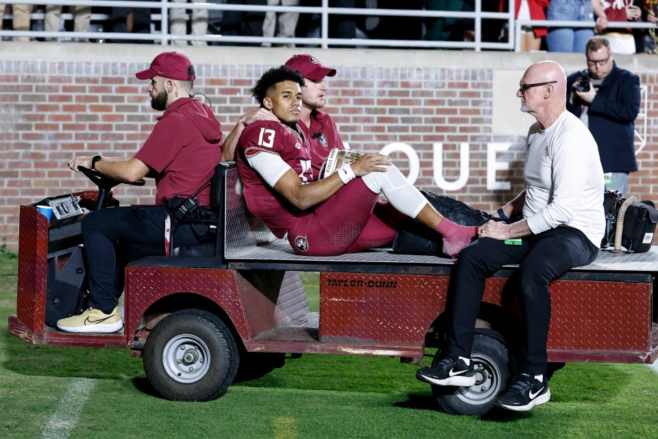 Injured Florida State Seminoles quarterback Jordan Travis being carted off the field.