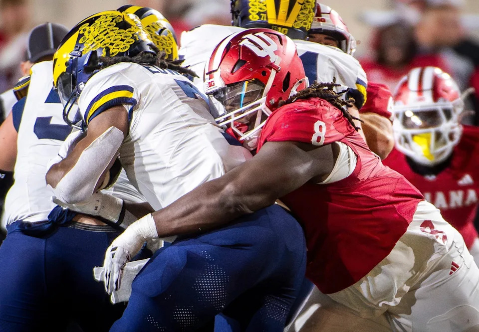Indiana's CJ West tackles Michigan's Donovan Edwards at Memorial Stadium on Saturday, Nov. 9, 2024.
