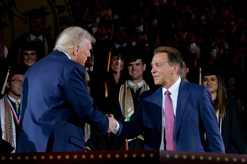 TUSCALOOSA, ALABAMA - MAY 01: U.S. President Donald Trump shakes hands with former Alabama Crimson Tide football coach Nick Saban as Trump takes the stage to address graduating students at Coleman Coliseum at the University of Alabama on May 01, 2025 in Tuscaloosa, Alabama. Trump's remarks come the day before commencement ceremonies. (Photo by Anna Moneymaker/Getty Images)