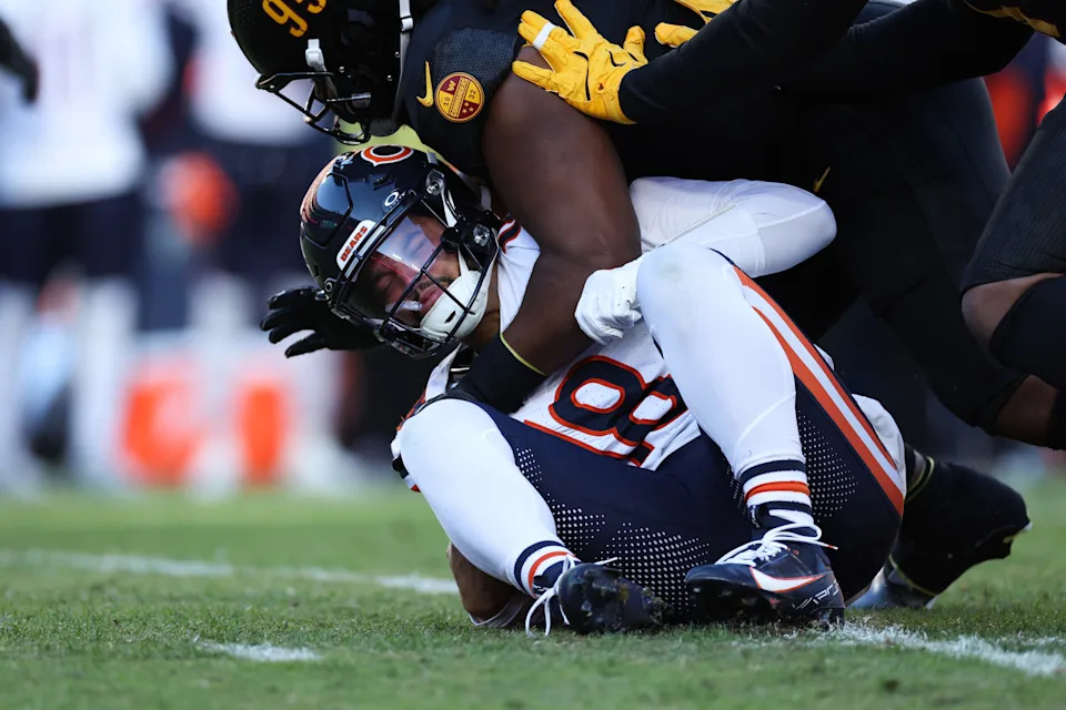 LANDOVER, MARYLAND - OCTOBER 27: Caleb Williams #18 of the Chicago Bears reacts after being sacked by Jer'Zhan Newton #95 of the Washington Commanders during the first quarter at Northwest Stadium on October 27, 2024 in Landover, Maryland. (Photo by Scott Taetsch/Getty Images)