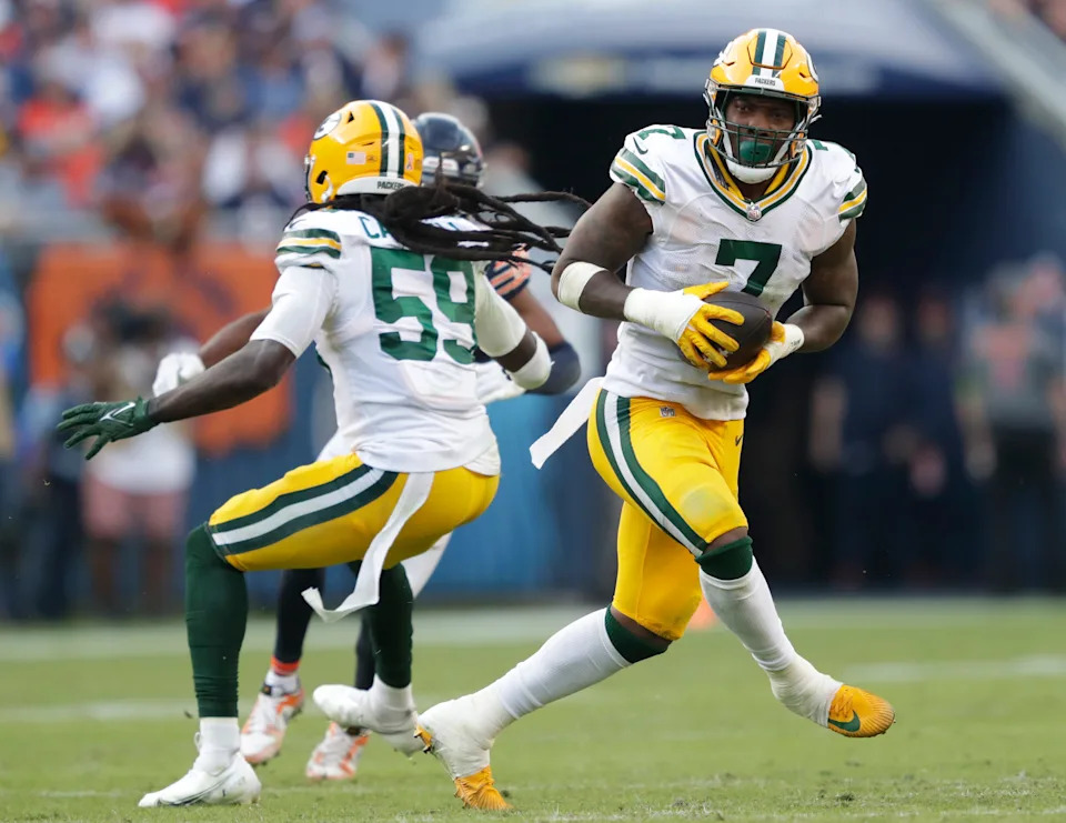 Sep 10, 2023; Chicago, Illinois, USA; Green Bay Packers linebacker Quay Walker (7) runs back an interception for a touchdown against the Chicago Bears in the fourth quarter during their football game at Soldier Field. Mandatory Credit: Dan Powers-USA TODAY Sports