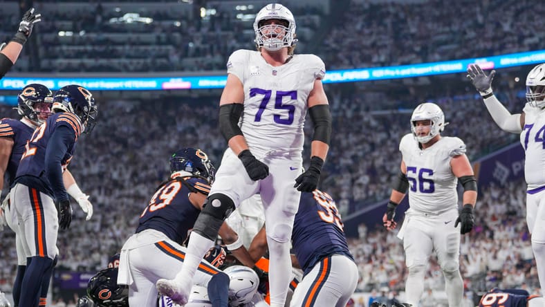 Brian O’Neill celebrates with Cam Akers after a touchdown against the Chicago Bears.