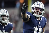 Dallas Cowboys linebacker Micah Parsons celebrates after sacking Washington Commanders...