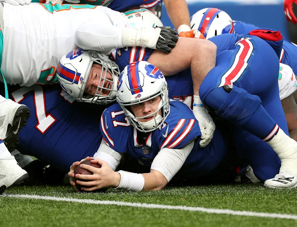 Bills quarterback Josh Allen looks at the first-down marker after his sneak got the first down in a season-ending win over the Dolphins on Dec. 30, 2018.

Jg 123018 Bills 31