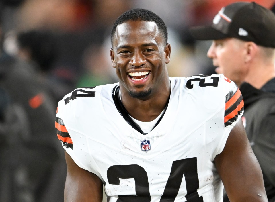 Nick Chubb, wearing a Cleveland Browns uniform, smiles.