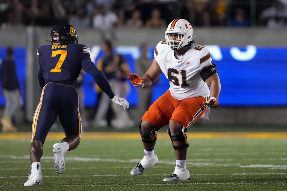 Oct 5, 2024; Berkeley, California, USA; Miami Hurricanes offensive lineman Francis Mauigoa (61) blocks against California Golden Bears linebacker David Reese (7) during the first quarter at California Memorial Stadium. Mandatory Credit: Darren Yamashita-Imagn Images