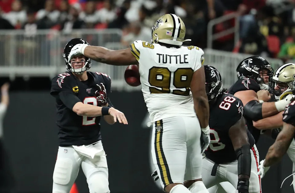 Nov 28, 2019; Atlanta Falcons quarterback Matt Ryan (2) throws an interception to New Orleans Saints defensive tackle Shy Tuttle (99). Mandatory Credit: Jason Getz-Imagn Images