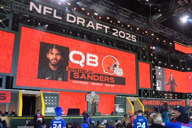 Shedeur Sanders' name after being selected by the Cleveland Browns with the 144th overall pick