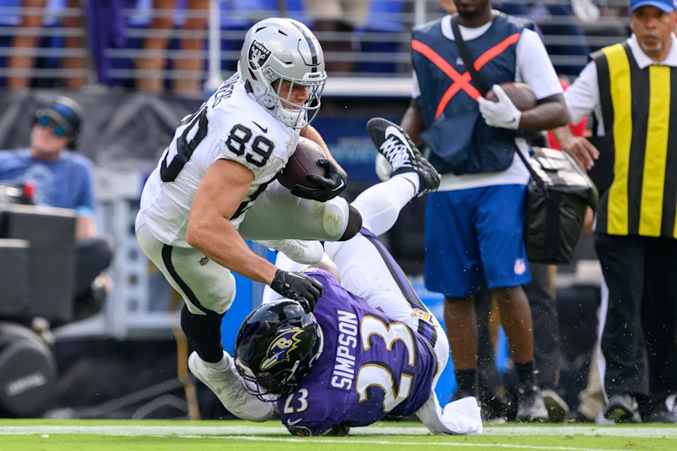 Sep 15, 2024; Baltimore, Maryland, USA; Las Vegas Raiders tight end Brock Bowers (89) is tackled by Baltimore Ravens linebacker Trenton Simpson (23) during the second half at M&T Bank Stadium. Mandatory Credit: Reggie Hildred-Imagn Images