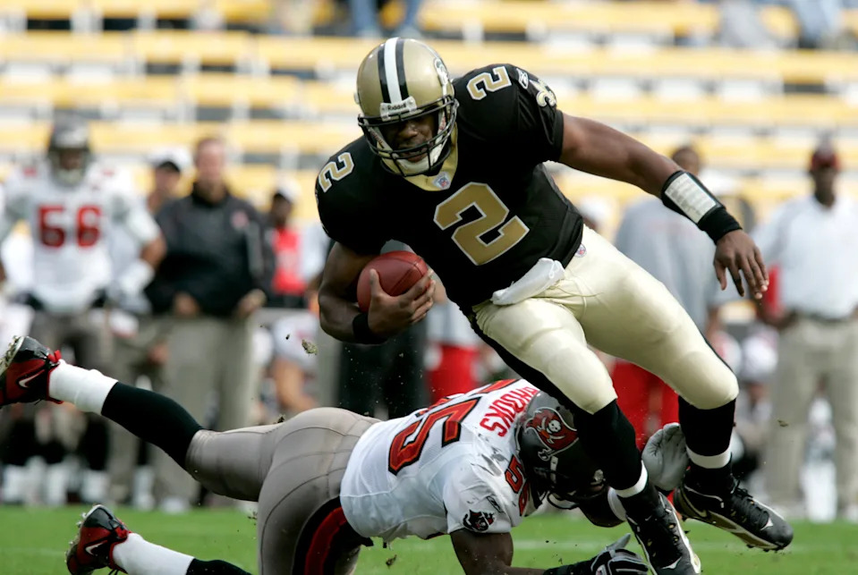 Dec. 4, 2005: Baton Rouge, LA, USA New Orleans Saints quarterback Aaron Brooks (2) is tripped up by Tampa Bay Buccaneers linebacker Derrick Brooks during the first half at Tiger Stadium in Baton Rouge, LA. Mandatory Credit: Matt Stamey-USA TODAY Sports Copyright Matt Stamey