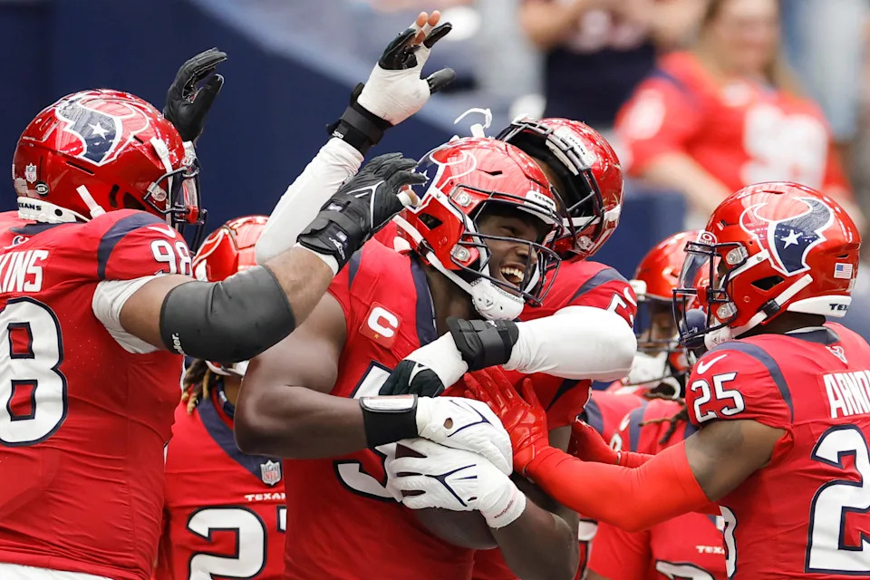 HOUSTON, TEXAS - OCTOBER 01: Houston Texans player celebrate with Will Anderson Jr. #51 of the Houston Texans after Anderson's interception during the fourth quarter against the Pittsburgh Steelers at NRG Stadium on October 01, 2023 in Houston, Texas. (Photo by Carmen Mandato/Getty Images)